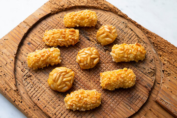 Panellets, traditional sweet dessert from Barcelona and Valencia made with potato, eggs, sugar and different nuts like almonds or  pinions. 