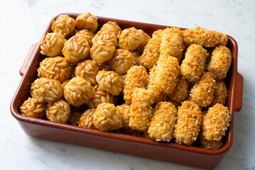 Panellets, traditional sweet dessert from Barcelona and Valencia made with potato, eggs, sugar and different nuts like almonds or  pinions. 
