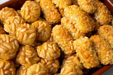 Panellets, traditional sweet dessert from Barcelona and Valencia made with potato, eggs, sugar and different nuts like almonds or  pinions. 