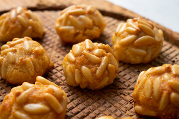 Panellets, traditional sweet dessert from Barcelona and Valencia made with potato, eggs, sugar and different nuts like almonds or  pinions. 