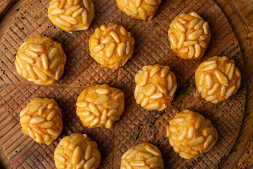 Panellets, traditional sweet dessert from Barcelona and Valencia made with potato, eggs, sugar and different nuts like almonds or  pinions. 
