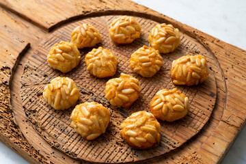 Panellets, traditional sweet dessert from Barcelona and Valencia made with potato, eggs, sugar and different nuts like almonds or  pinions. 