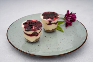 dessert with berries and flowers on a marble background