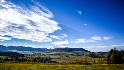 windy clouds against the backdrop of a mountain landscape