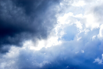 Naklejka na ściany i meble Blue and white cumulus storm clouds thunderstorm landscape