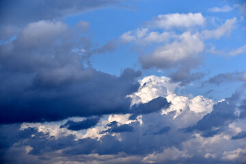 Blue and white cumulus storm clouds thunderstorm landscape