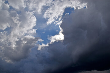 Blue and white cumulus storm clouds thunderstorm landscape