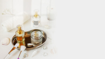 Blurry focus, skin care card with beauty products and cosmetic accessories for a face care treatment with sunlight and copy space. Preparation for the facials skin care procedure