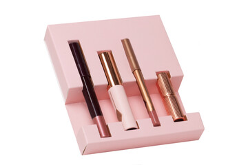 Cosmetic products. Close-up of various items of cosmetics without label in a pink package isolated on white background. Promotional spa, make-up and beauty concept.