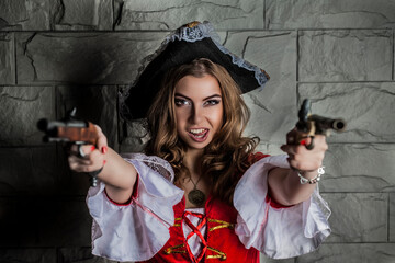 A pirate girl in a red doublet with two pistols smiles mischievously
