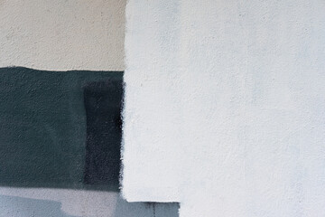 Abstract colorful wall texture background. White, green, black, beige and grey colour rough weathered stone texture. Painted wall. Beautiful, artistic, creative background in pastel tones. Copy space