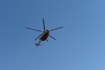 Fototapeta na wymiar MI-8 regular helicopter in the blue sky