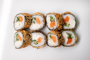 Sushi roll with salmon. Traditional Japanese cuisine side view.