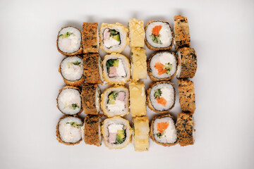 Sushi set with salmon, tuna and cream cheese top view. Traditional Japanese cuisine.
