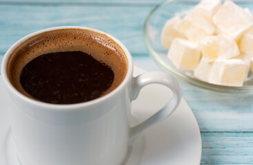Coffee in a white mug in Turkish close-up.