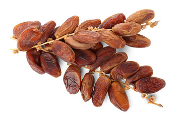 Sweet dates on branches against white background, top view. Dried fruit as healthy snack