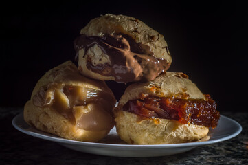 pães de queijo, cheese buns filled with dulce de leche, chocolate and guava jam 