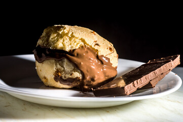 pão de queijo, cheese buns stuffed with chocolate in a white container,copy space and selective focus