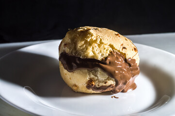 pão de queijo, cheese buns stuffed with chocolate in a white container,copy space and selective focus