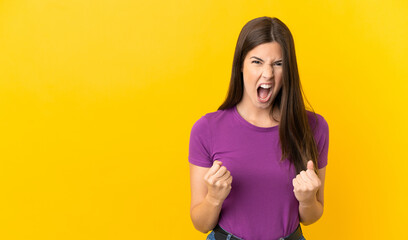 Obraz premium Teenager Brazilian girl over isolated yellow background frustrated by a bad situation