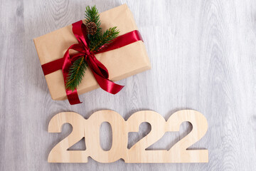 NEW year merry christmas and happy holiday wooden numbers 2022 on a light wooden background eco-friendly general plan in light colors place for text