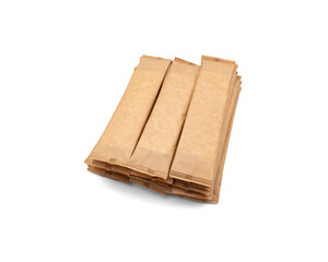 Eco-friendly wooden disposable cutlery. Fork, spoon and napkin in a craft envelope on a white background.