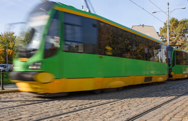 Tram blurred by motion, abstract photo, public transportation in Poznan, Poland.