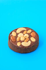 nut chocolate tartlet on the blue background