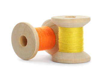 Different colorful sewing threads on white background
