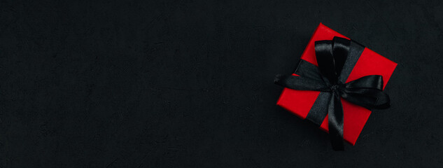 Red gift box with black satin ribbon
