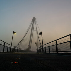 The Herrenkrugsteg, a suspension bridge over the river Elbe on the Elbe cycle path near Magdeburg in the fog