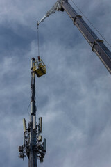 During infrastructure talks in Congress, technicians are upgrading cell phone antenna capabilities.