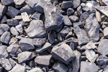 Crushed stones background on the railway. Close up stone texture, Crushed stone, railway ballast. Stones background.