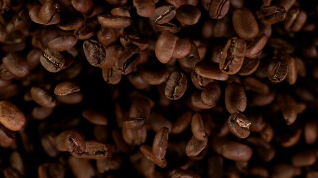 Coffee beans explosion. Super slow motion at 1000 fps, filmed on high speed cinematic camera.
