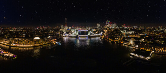 Aerial drone panorama of London Tower Bridge at Night. One of London's most famous bridges and...