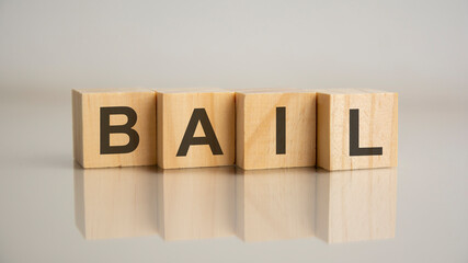 Four wooden cubes with letters Bail. Business marketing concept.