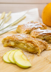 Strudel with apples. A wonderful dessert made of puff pastry.