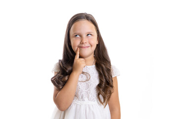 Fototapeta premium portrait of thoughtful, funny girl with rolled eyes, with long curls in white dress, isolated on white background with copy space. 