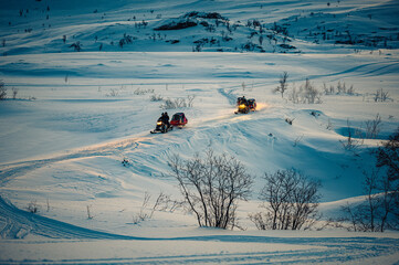 Beautiful view of people sliding in the snow