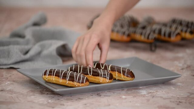 French dessert eclair with chocolate and custard. Traditional French dessert.