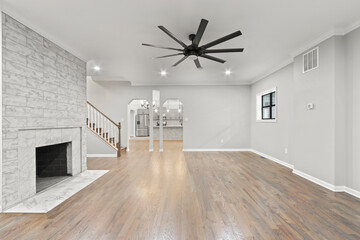 Luxury mansion empty living room with triple archway to kitchen
