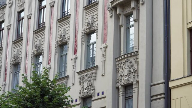 Sample of the jugendstil facade decorative elements in the capital of Riga on Alberta Street in the complex of famous Art Nouveau buildings in Latvia, Europe. An architectural view from bottom to top
