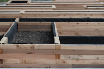 wooden garden beds under construction