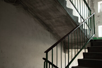 old dirty soviet entrance in an apartment building after a fire, a corridor in the entrance