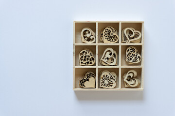 square wooden box with laser cut wooden shapes or hearts
