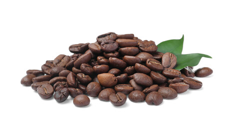 Pile of roasted coffee beans with fresh leaves on white background