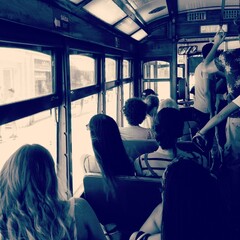 people in the tram in lisbon portugal