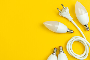 Energy efficiency. LED light bulbs and electrical power cable with EU plug. Save the planet, energy saving concept