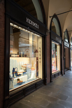 Bologna Italy. October 2021.  the shop windows of the Hermes brand under a portico in the city center