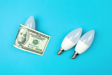 Energy efficiency concept. LED light bulb and dollar money bill. Saving energy banner